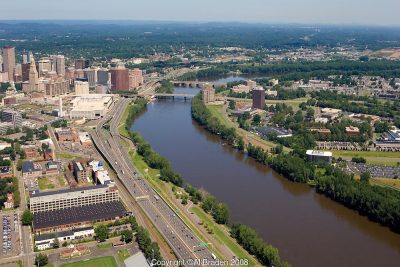 Aerial of Hartford Skyline and Connecticut River. Riverfront parks line both sides of the river